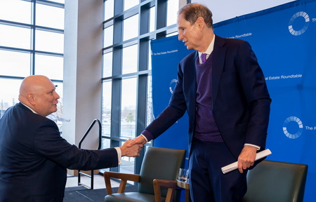 Real Estate Roundtable President and CEO Jeffrey Deboer shakes hands with Senate Finance Committee Chair Ron Wyden (D-OR)