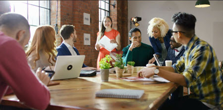 Healthy workplace with employees at table