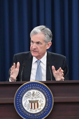 Fed Raises Interest Rates, Signals More Hikes, Boosts Economic Forecasts